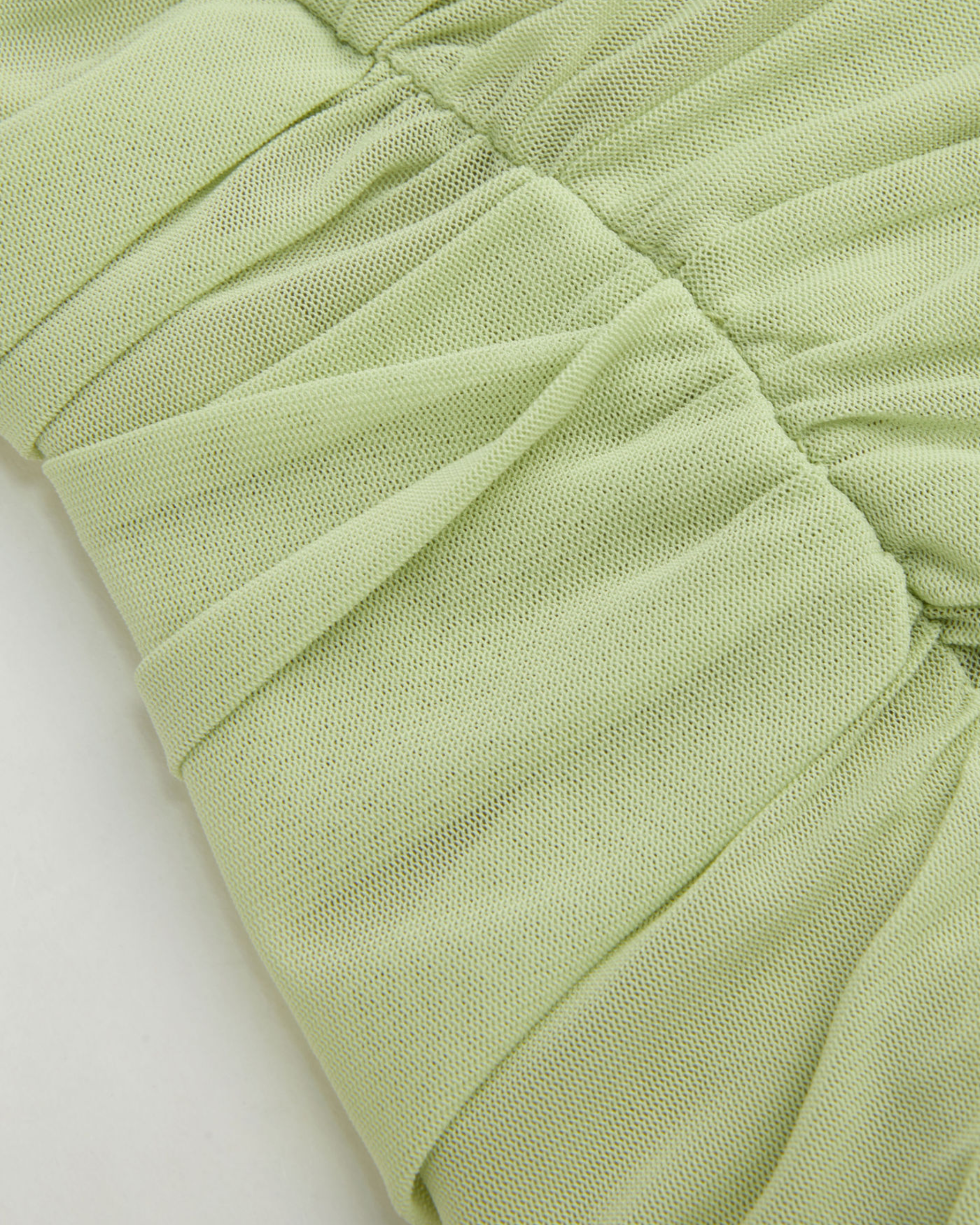 Women’s Solid Mesh Asymmetrical Neck Mini Dress with Layered Ruffle Hem.