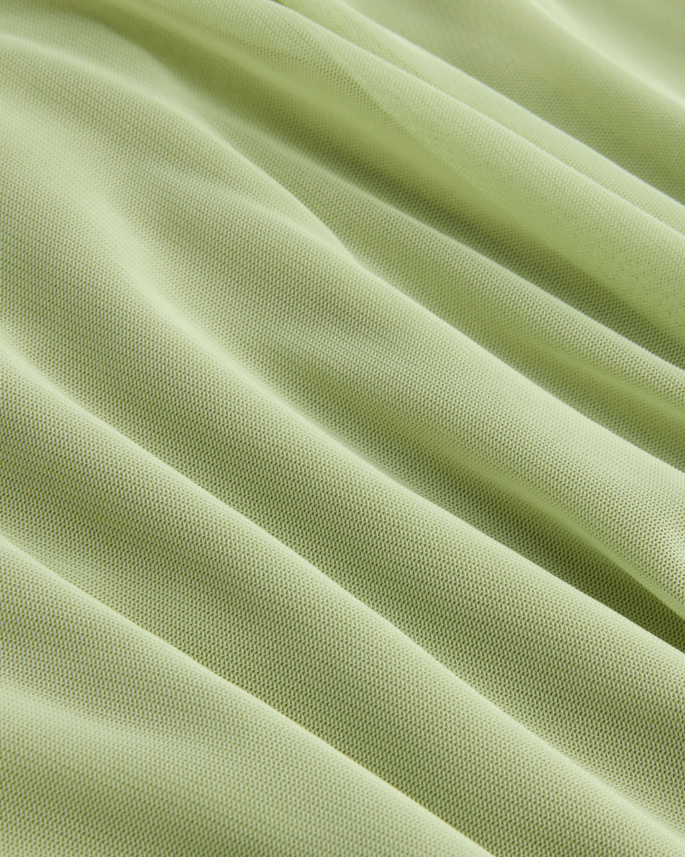 Women’s Solid Mesh Asymmetrical Neck Mini Dress with Layered Ruffle Hem.